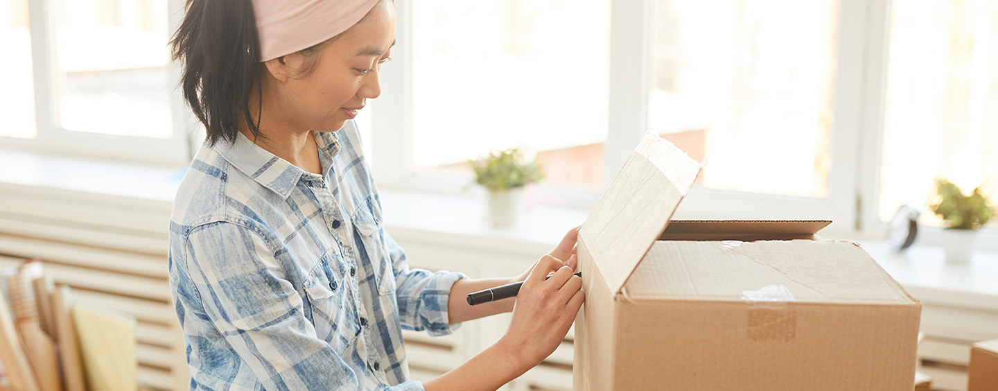 Woman packing a box 